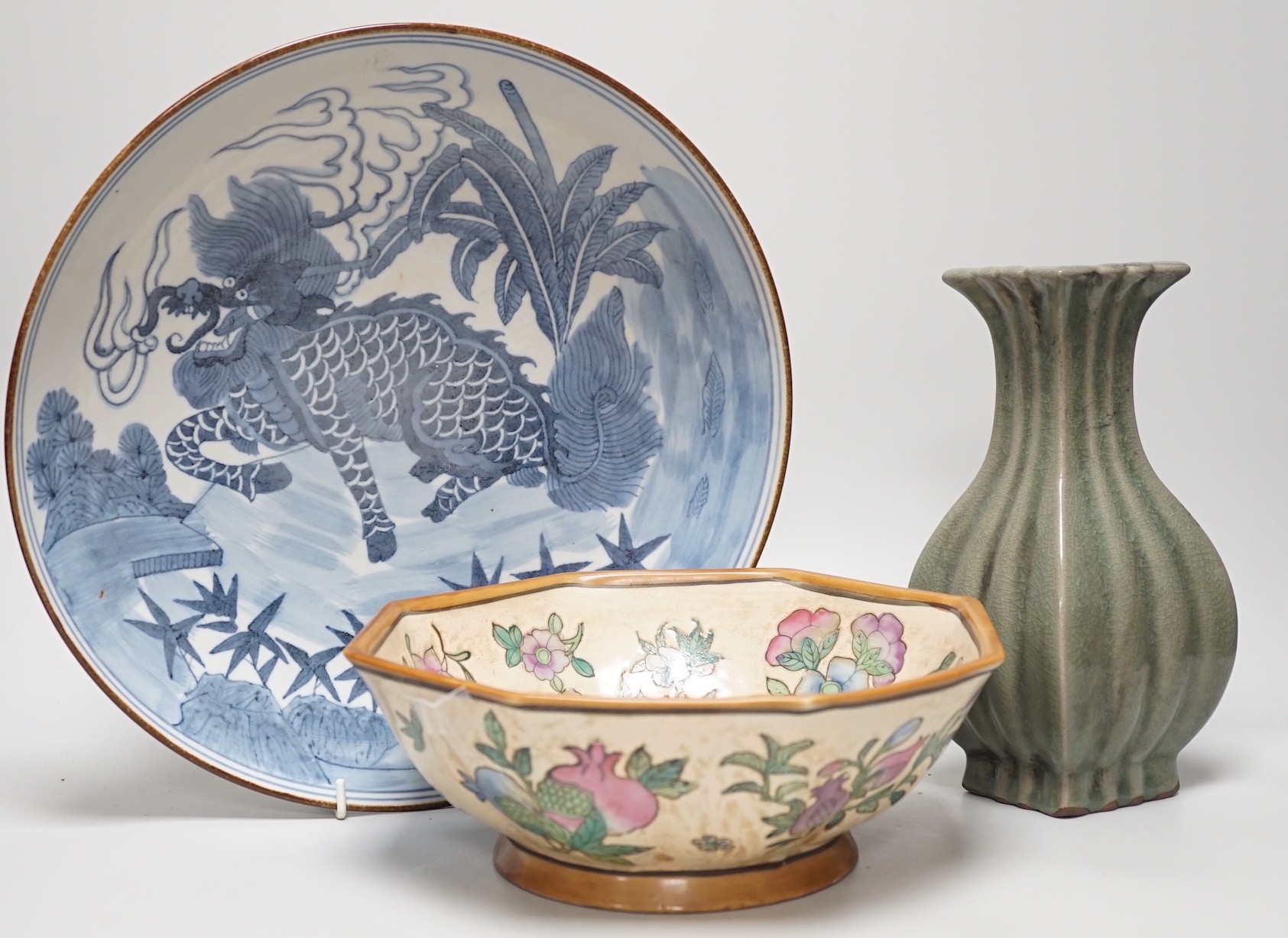 A Chinese blue and white ‘qilin’ dish, an octagonal bowl and a Korean celadon vase (3) largest 33cm diameter